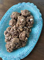 A plate of freshly baked almond butter s'mores cookies, featuring chocolate chips and mini marshmallows.